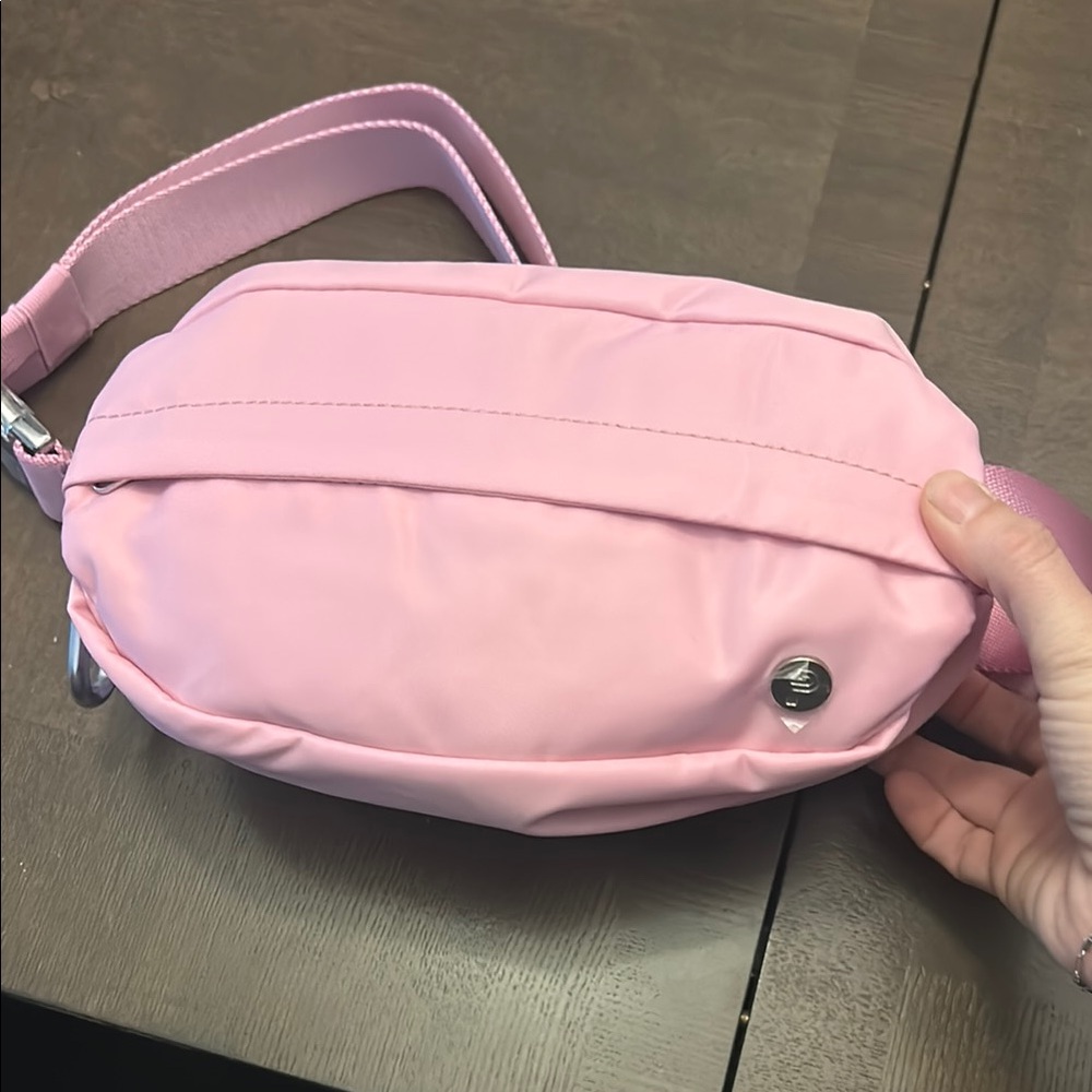 New never used pink belt bag